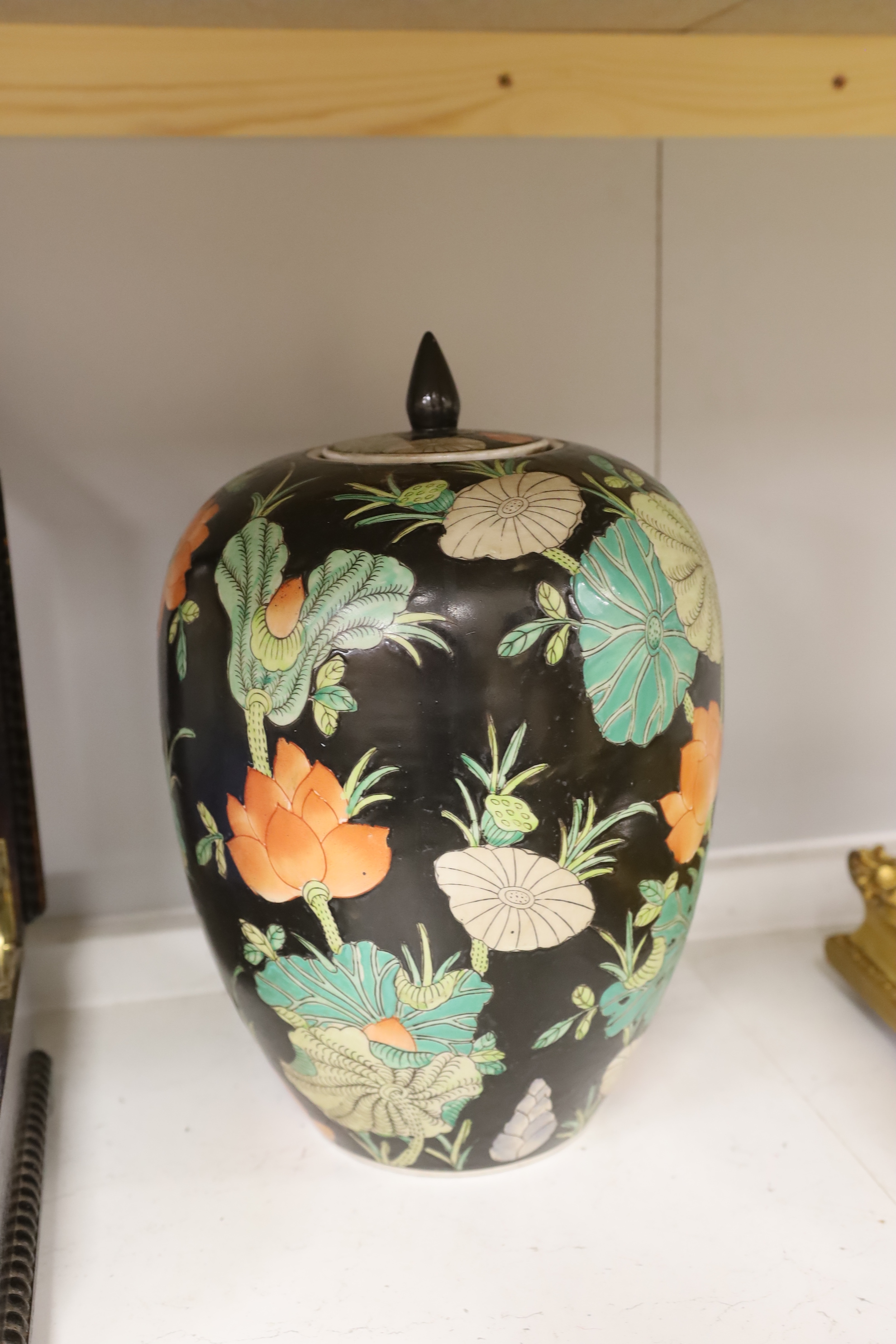 A Chinese famille noire vase and cover, three ginger jars and a jardiniere, largest 33cm